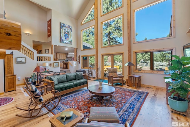180 Nottingham Ct, Reno, NV 89511 - living room featuring high vaulted ceiling, hardwood / wood-style flooring, and baseboards