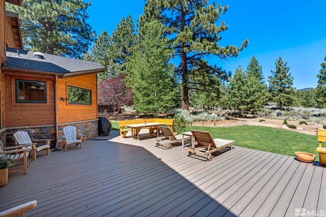 180 Nottingham Ct, Reno, NV 89511 - wooden deck with a yard and outdoor dining area