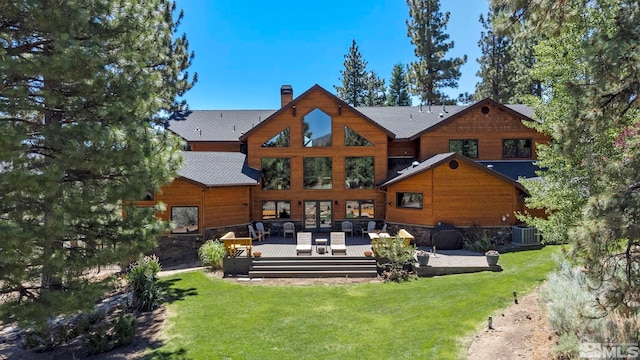180 Nottingham Ct, Reno, NV 89511 - rear view of house featuring a chimney, cooling unit, a deck, a yard, and french doors