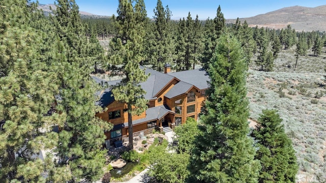 180 Nottingham Ct, Reno, NV 89511 - aerial view of property and surrounding area featuring a heavily wooded area and a mountainous background