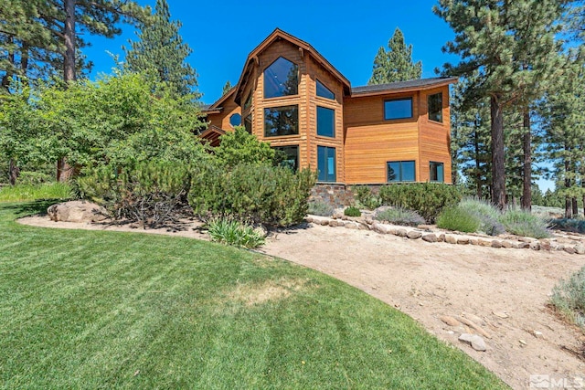180 Nottingham Ct, Reno, NV 89511 - view of front of property featuring a front yard and stone siding