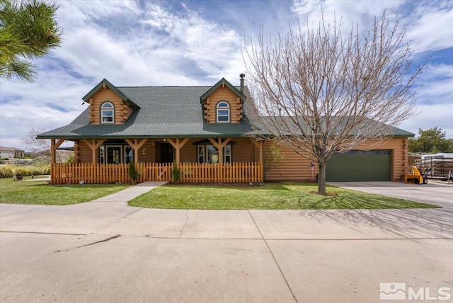 8705 Spearhead Way, Reno, NV 89506 - log home featuring a porch, log exterior, driveway, and an attached garage