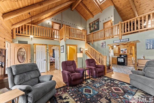8705 Spearhead Way, Reno, NV 89506 - living area featuring high vaulted ceiling, wooden ceiling, wood finished floors, stairway, and beam ceiling