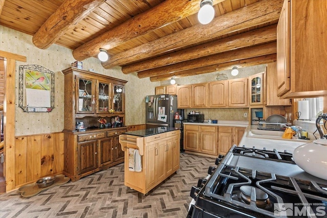8705 Spearhead Way, Reno, NV 89506 - kitchen with fridge with ice dispenser, a wainscoted wall, wood ceiling, glass insert cabinets, and wallpapered walls