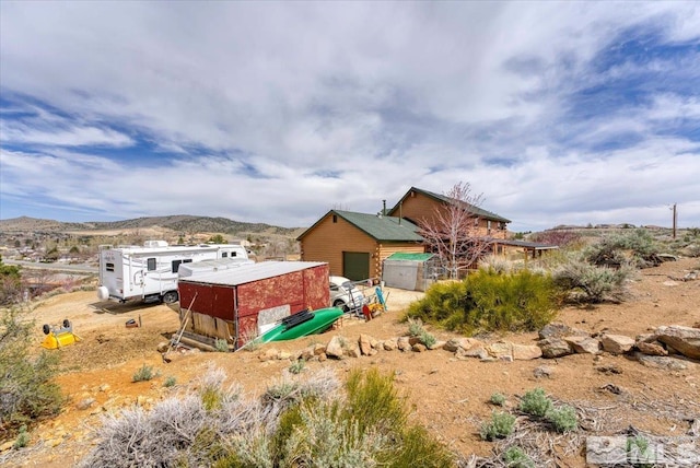 8705 Spearhead Way, Reno, NV 89506 - back of property featuring a mountain view and an outdoor structure