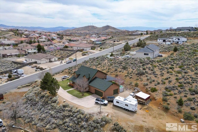 8705 Spearhead Way, Reno, NV 89506 - aerial view of residential area with a mountainous background