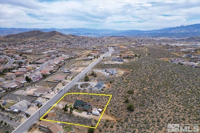 8705 Spearhead Way, Reno, NV 89506 - aerial view of residential area with a mountainous background and property parcel outlined