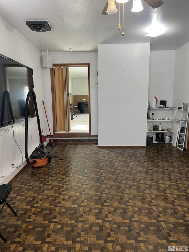 115 Birch St, Hawthorne, NV 89415 - garage featuring ceiling fan and baseboards