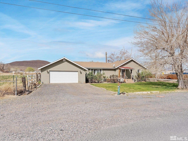 325 Stock Ln, Fernley, NV 89408 - single story home with an attached garage and gravel driveway