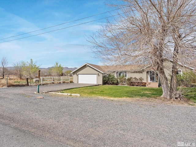325 Stock Ln, Fernley, NV 89408 - ranch-style home featuring asphalt driveway and a garage