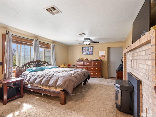 325 Stock Ln, Fernley, NV 89408 - bedroom with light colored carpet, a textured ceiling, and a ceiling fan
