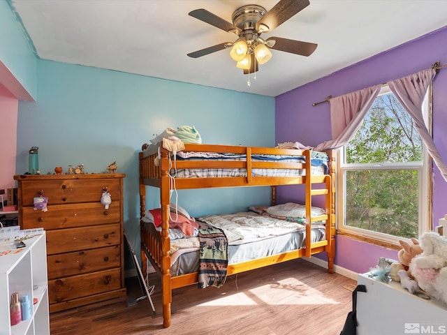 325 Stock Ln, Fernley, NV 89408 - bedroom with wood finished floors, ceiling fan, and baseboards
