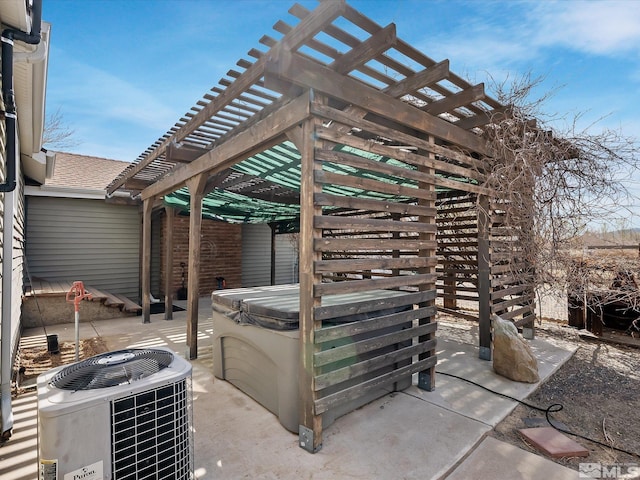 325 Stock Ln, Fernley, NV 89408 - view of patio with central AC unit, a pergola, and a hot tub