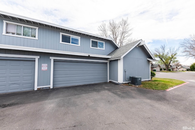 2271 Oppio St, Sparks, NV 89431 - view of property exterior with cooling unit, driveway, and a shingled roof