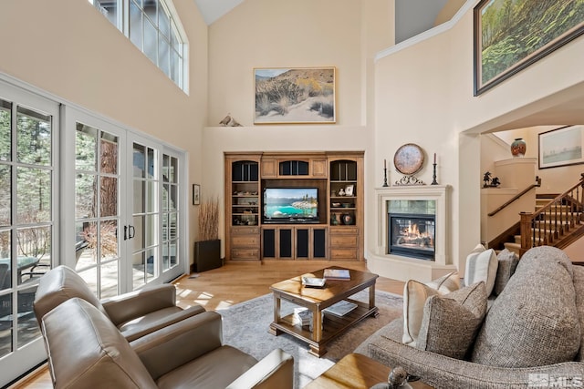 6554 Champetre, Reno, NV 89511 - living area with a high ceiling, wood finished floors, a fireplace, and stairway