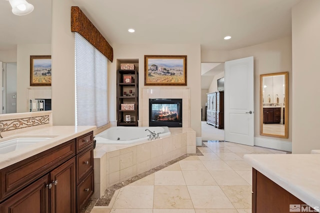 6554 Champetre, Reno, NV 89511 - full bath with a tiled fireplace, a garden tub, vanity, and recessed lighting