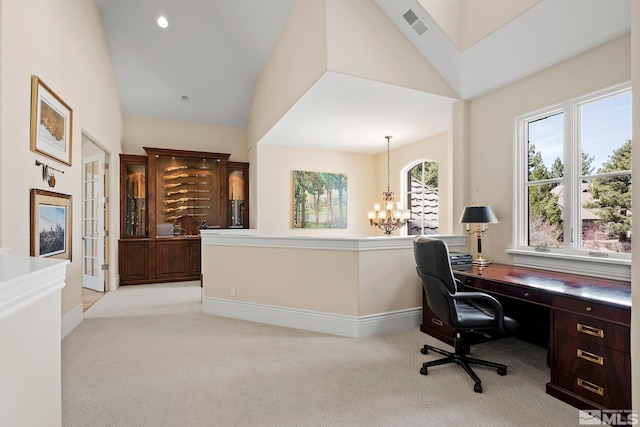 6554 Champetre, Reno, NV 89511 - home office featuring light colored carpet, a chandelier, baseboards, and high vaulted ceiling