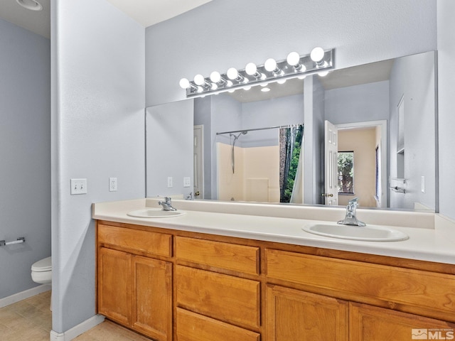 1974 Spring Rd, Fernley, NV 89408 - bathroom with double vanity, toilet, curtained shower, and baseboards