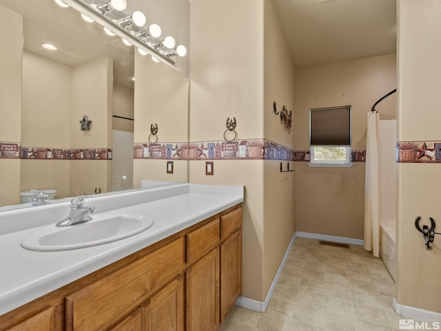 1974 Spring Rd, Fernley, NV 89408 - full bath with vanity, shower / tub combo, and baseboards