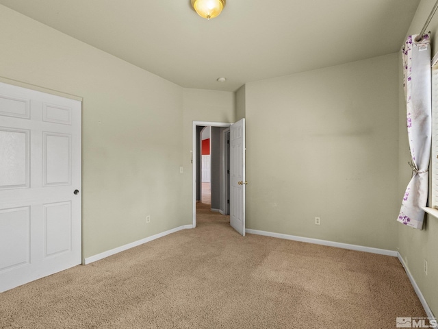 1974 Spring Rd, Fernley, NV 89408 - unfurnished bedroom with carpet and baseboards