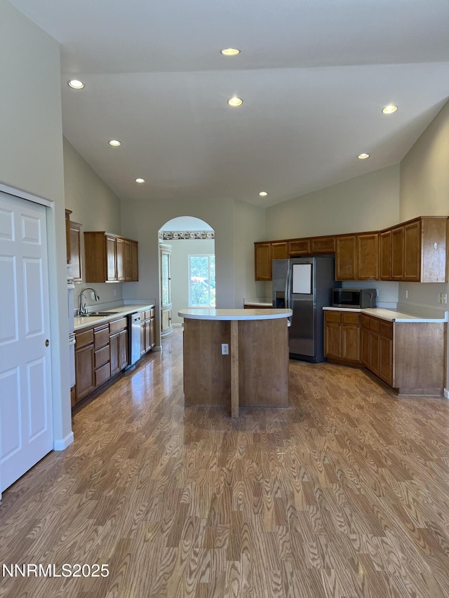 1974 Spring Rd, Fernley, NV 89408 - kitchen featuring stainless steel appliances, arched walkways, wood finished floors, light countertops, and recessed lighting