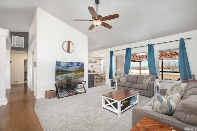 1675 Skyridge Dr, Fallon, NV 89406 - living room featuring ceiling fan, wood finished floors, arched walkways, baseboards, and high vaulted ceiling