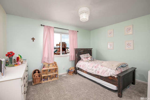 1675 Skyridge Dr, Fallon, NV 89406 - bedroom with carpet flooring, baseboards, and a chandelier