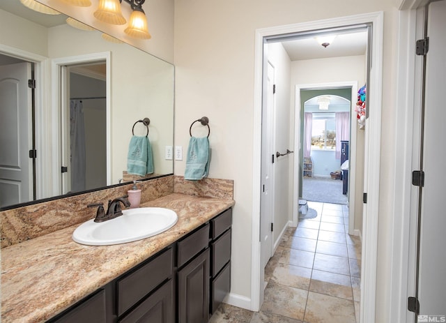 1675 Skyridge Dr, Fallon, NV 89406 - bathroom featuring vanity, baseboards, and tile patterned flooring