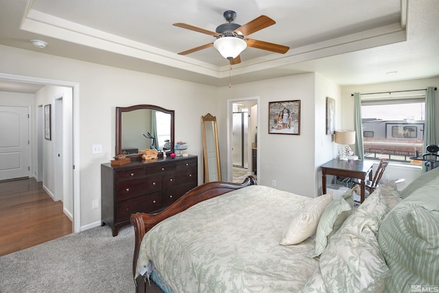 1675 Skyridge Dr, Fallon, NV 89406 - carpeted bedroom with a raised ceiling, baseboards, and a ceiling fan