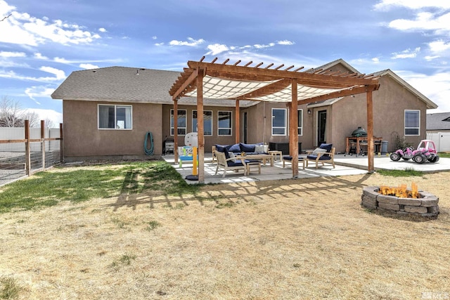 1675 Skyridge Dr, Fallon, NV 89406 - rear view of house featuring an outdoor living space with a fire pit, a pergola, stucco siding, a fenced backyard, and a patio area