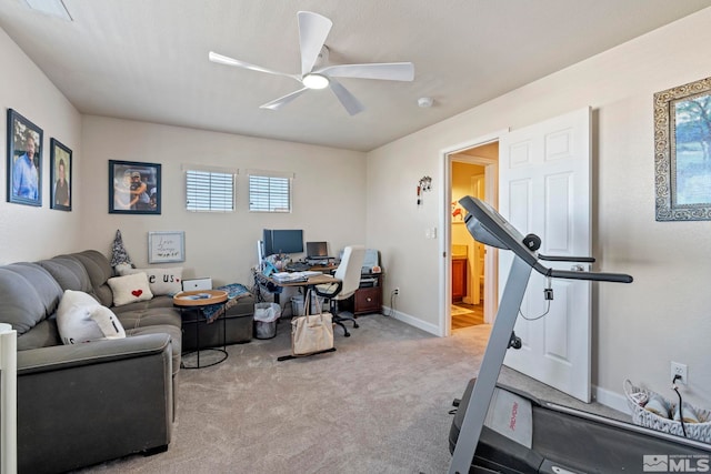 exercise area featuring a ceiling fan, carpet floors, plenty of natural light, and baseboards