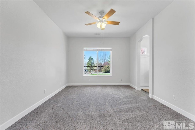7871 Cantabria Dr, Sparks, NV 89436 - carpeted empty room featuring ceiling fan and arched walkways