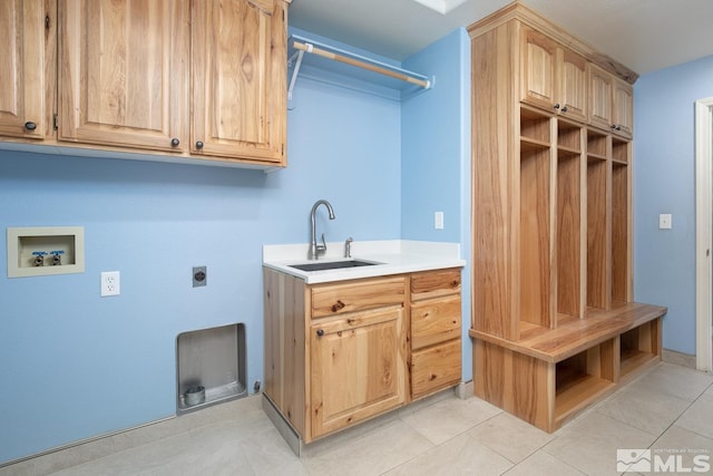 1580 Golden Park Way, Fallon, NV 89406 - laundry area featuring washer hookup, electric dryer hookup, cabinet space, and light tile patterned floors