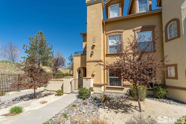 17000 Wedge Pkwy Unit 111, Reno, NV 89511 - view of property with fence