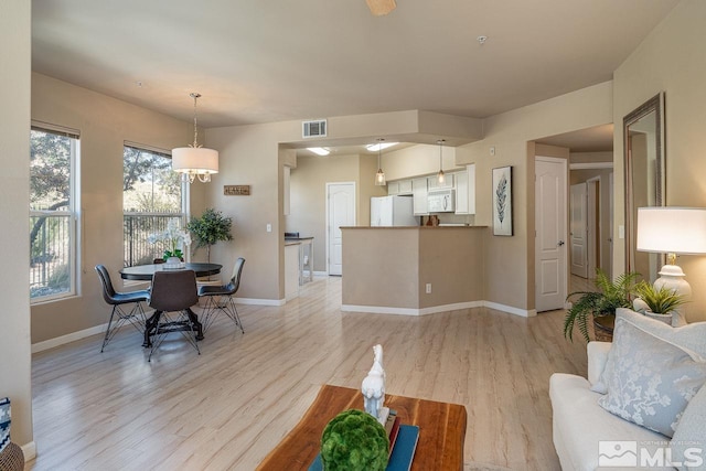 17000 Wedge Pkwy Unit 111, Reno, NV 89511 - living area with light wood-type flooring and baseboards