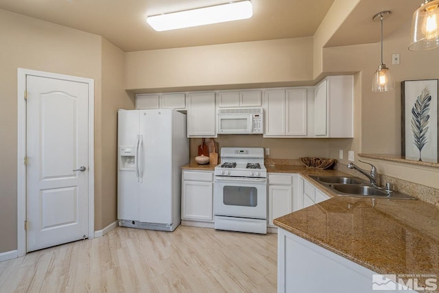 17000 Wedge Pkwy Unit 111, Reno, NV 89511 - kitchen featuring white appliances, a sink, white cabinets, and light wood finished floors