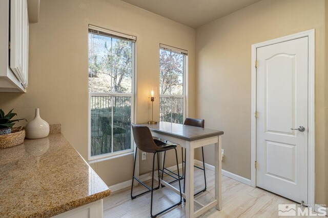 17000 Wedge Pkwy Unit 111, Reno, NV 89511 - dining space featuring light wood-type flooring and baseboards