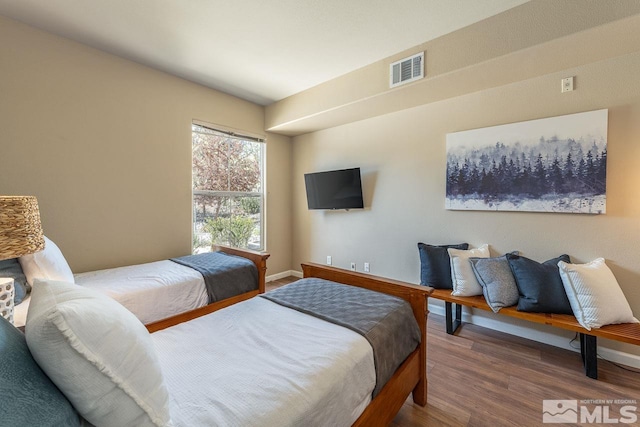 17000 Wedge Pkwy Unit 111, Reno, NV 89511 - bedroom featuring wood finished floors and baseboards