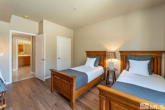 17000 Wedge Pkwy Unit 111, Reno, NV 89511 - bedroom with dark wood-style flooring and baseboards