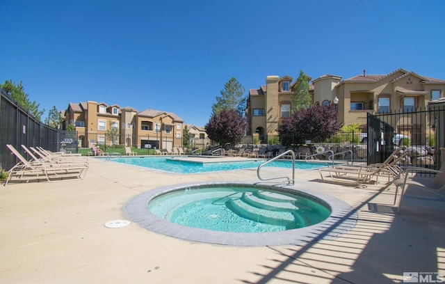 17000 Wedge Pkwy Unit 111, Reno, NV 89511 - community pool featuring fence, a patio area, a residential view, and a hot tub