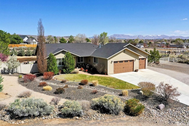 1367 Porter Dr, Minden, NV 89423 - ranch-style home featuring a garage, concrete driveway, and a mountain view