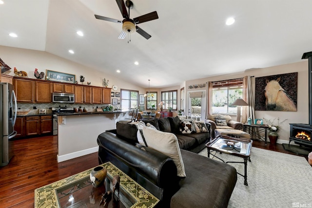 1367 Porter Dr, Minden, NV 89423 - living room with plenty of natural light, a ceiling fan, recessed lighting, dark wood-style floors, and vaulted ceiling