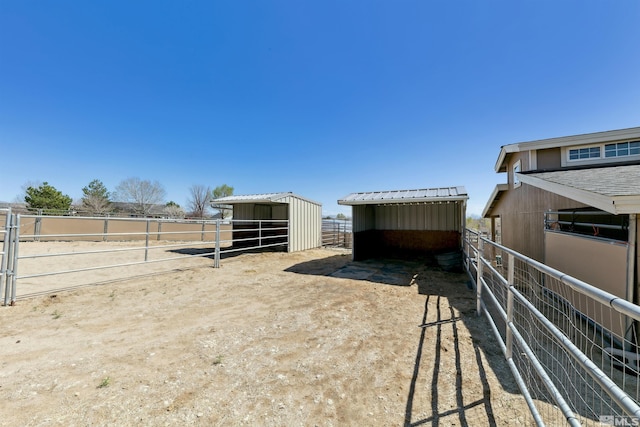 1367 Porter Dr, Minden, NV 89423 - view of yard featuring an exterior structure, a carport, and an outdoor structure