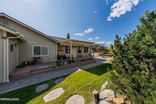 1367 Porter Dr, Minden, NV 89423 - rear view of property with a patio, a pergola, and a lawn