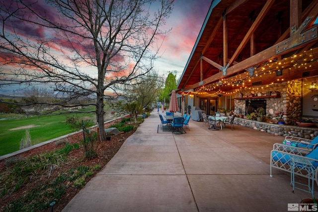 951 Riverview Dr, Gardnerville, NV 89460 - patio terrace at dusk with outdoor dining area
