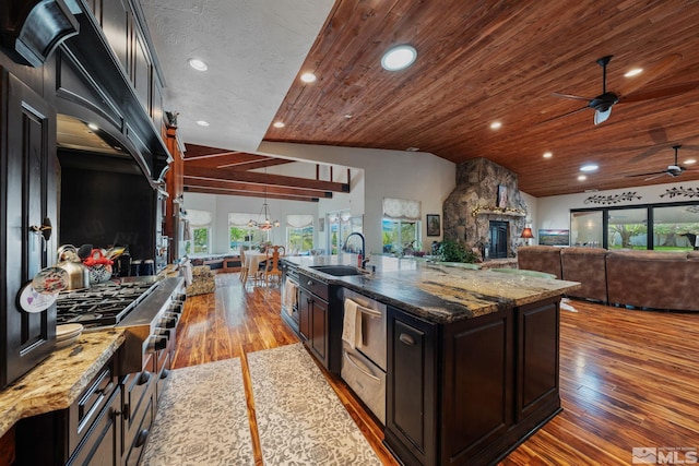 951 Riverview Dr, Gardnerville, NV 89460 - kitchen featuring a sink, ceiling fan, plenty of natural light, wood finished floors, and lofted ceiling
