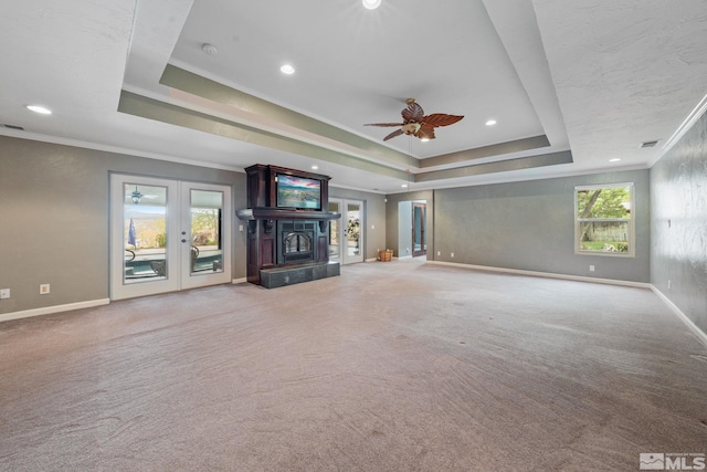 951 Riverview Dr, Gardnerville, NV 89460 - unfurnished living room with a raised ceiling, baseboards, ornamental molding, carpet floors, and healthy amount of natural light