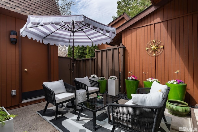 view of patio with a fenced backyard and an outdoor hangout area