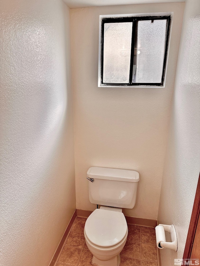 4985 W 7th St Unit 11, Reno, NV 89503 - bathroom featuring tile patterned flooring, toilet, and baseboards