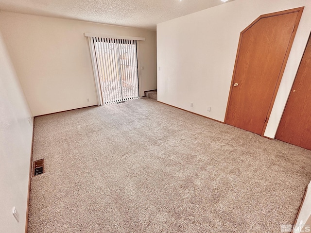 4985 W 7th St Unit 11, Reno, NV 89503 - carpeted empty room with a textured ceiling